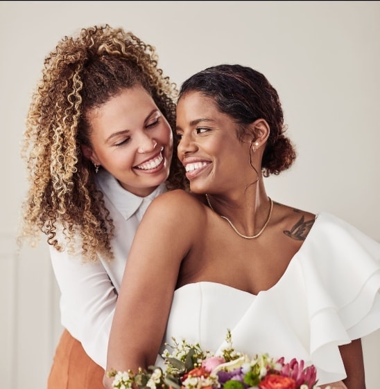 Two women sharing a warm, connected moment together